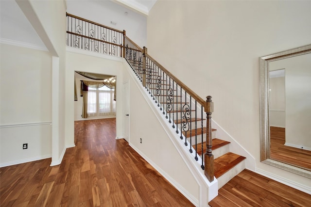 3006 Nickleby Ct, Katy, TX 77494 - staircase with wood finished floors, crown molding, baseboards, and a high ceiling