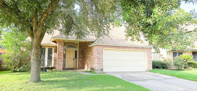 1538 Ridgebriar Dr, Houston, TX 77014 - view of front of property featuring driveway, a front yard, brick siding, and an attached garage