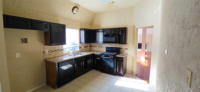 1538 Ridgebriar Dr, Houston, TX 77014 - kitchen featuring black appliances, dark cabinetry, backsplash, light tile patterned floors, and vaulted ceiling
