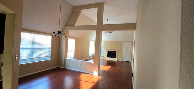 1538 Ridgebriar Dr, Houston, TX 77014 - spare room with dark wood finished floors, a fireplace, a chandelier, lofted ceiling, and ceiling fan