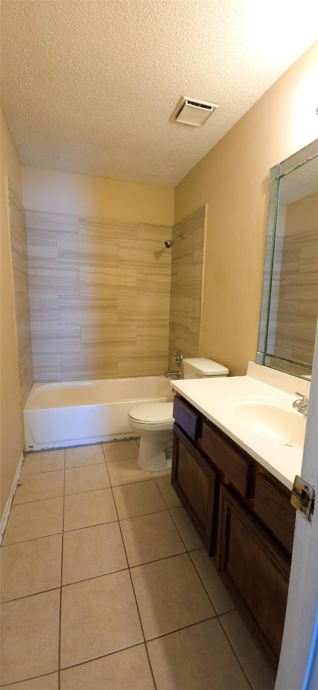 1538 Ridgebriar Dr, Houston, TX 77014 - bathroom featuring vanity, tile patterned floors, a textured ceiling, and  shower combination