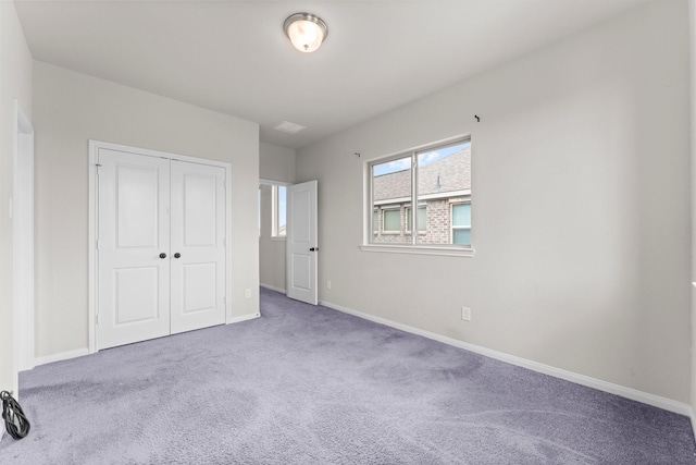 15739 Cairnwell Bend Dr, Humble, TX 77346 - unfurnished bedroom featuring carpet flooring, a closet, and baseboards