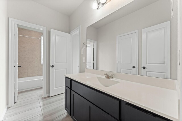15739 Cairnwell Bend Dr, Humble, TX 77346 - full bathroom featuring vanity, washtub / shower combination, and tile patterned flooring