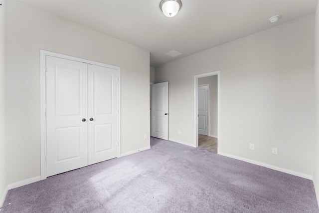 15739 Cairnwell Bend Dr, Humble, TX 77346 - unfurnished bedroom featuring carpet floors, baseboards, and a closet