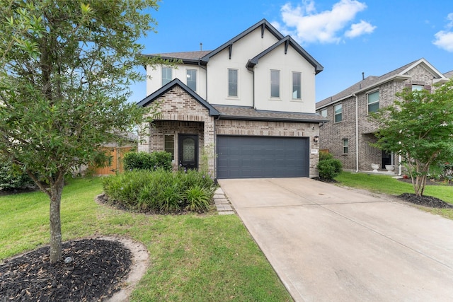 15739 Cairnwell Bend Dr, Humble, TX 77346 - view of front facade featuring an attached garage, concrete driveway, stucco siding, and a front yard