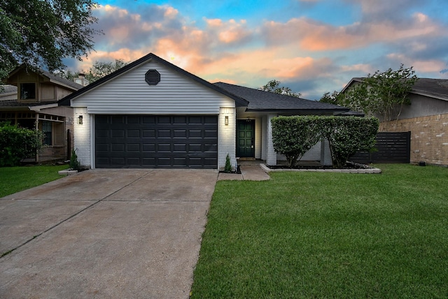 2012 Hickory Glen Dr, Missouri City, TX 77489 - ranch-style house with an attached garage, concrete driveway, brick siding, and a yard