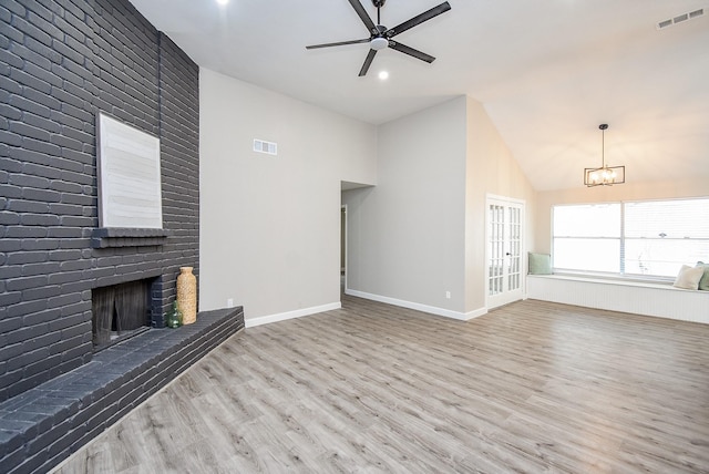 2012 Hickory Glen Dr, Missouri City, TX 77489 - unfurnished living room featuring wood finished floors, a brick fireplace, a ceiling fan, a chandelier, and baseboards