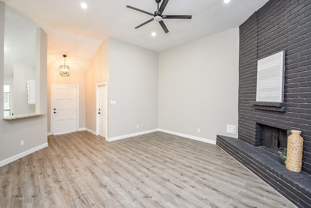 2012 Hickory Glen Dr, Missouri City, TX 77489 - unfurnished living room with ceiling fan, wood finished floors, recessed lighting, baseboards, and vaulted ceiling