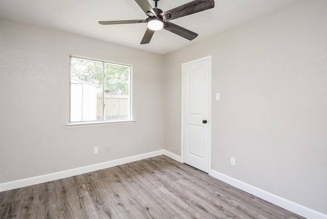 2012 Hickory Glen Dr, Missouri City, TX 77489 - unfurnished room with wood finished floors, baseboards, and ceiling fan