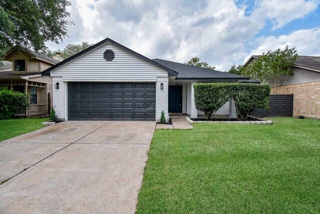 2012 Hickory Glen Dr, Missouri City, TX 77489 - single story home featuring brick siding, driveway, an attached garage, and a front yard