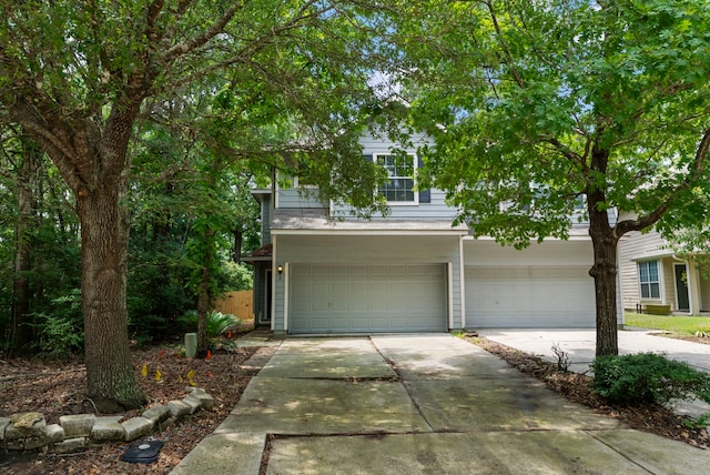 3 E Summerhaze Cir, Spring, TX 77382 - view of front of house featuring driveway and an attached garage