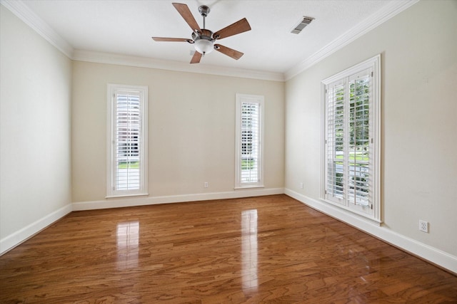 1615 Lake Wilderness Ln, Kingwood, TX 77345 - spare room with wood finished floors, crown molding, and baseboards