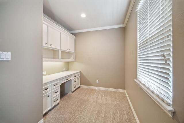 1615 Lake Wilderness Ln, Kingwood, TX 77345 - unfurnished office featuring ornamental molding, built in desk, light colored carpet, baseboards, and recessed lighting