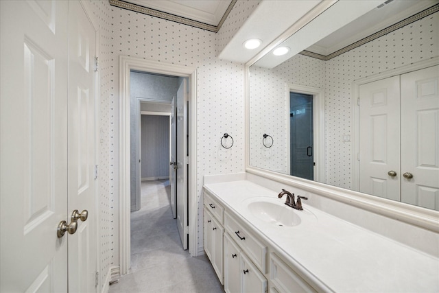 1615 Lake Wilderness Ln, Kingwood, TX 77345 - bathroom with vanity, tile patterned floors, and crown molding