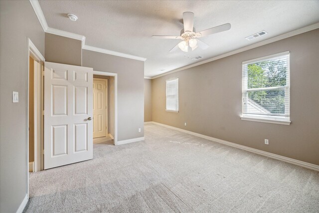 1615 Lake Wilderness Ln, Kingwood, TX 77345 - unfurnished bedroom with carpet flooring, ornamental molding, baseboards, and ceiling fan