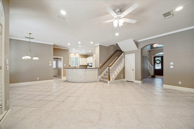 1615 Lake Wilderness Ln, Kingwood, TX 77345 - unfurnished living room with ornamental molding, ceiling fan, recessed lighting, baseboards, and light tile patterned floors