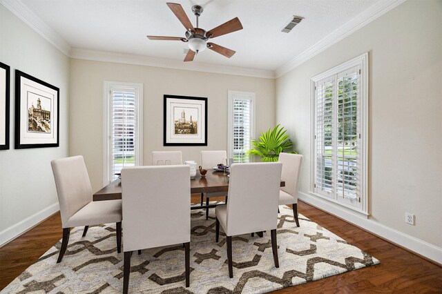 1615 Lake Wilderness Ln, Kingwood, TX 77345 - dining area with crown molding, baseboards, a ceiling fan, and wood finished floors