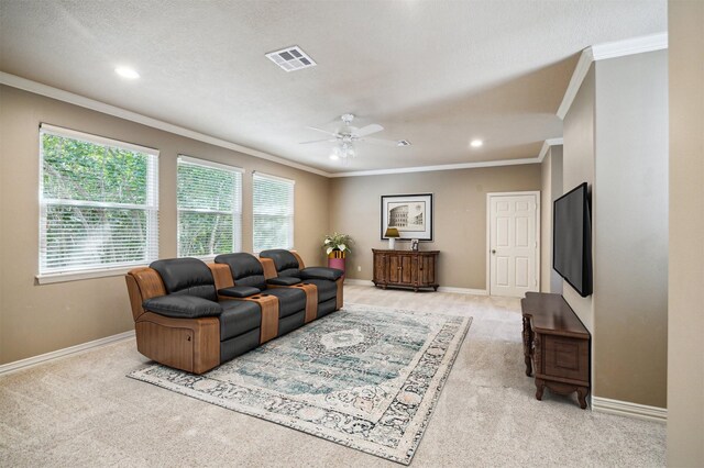 1615 Lake Wilderness Ln, Kingwood, TX 77345 - living room featuring light colored carpet, ornamental molding, a ceiling fan, healthy amount of natural light, and baseboards