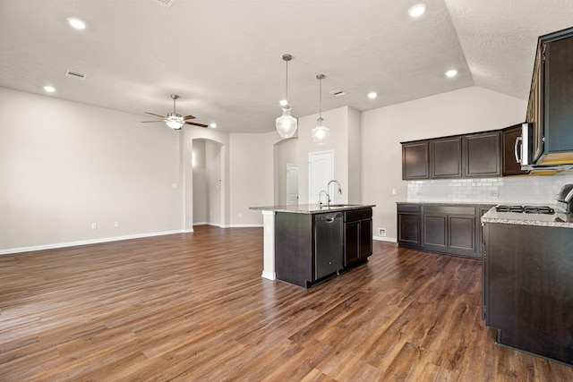 14370 S Summerchase Cir, Willis, TX 77318 - kitchen featuring a sink, appliances with stainless steel finishes, arched walkways, a center island with sink, and ceiling fan