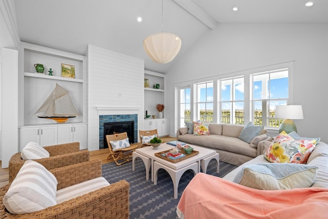 2604 E Seaside Dr, Galveston, TX 77550 - living area with beamed ceiling, a glass covered fireplace, recessed lighting, high vaulted ceiling, and built in features