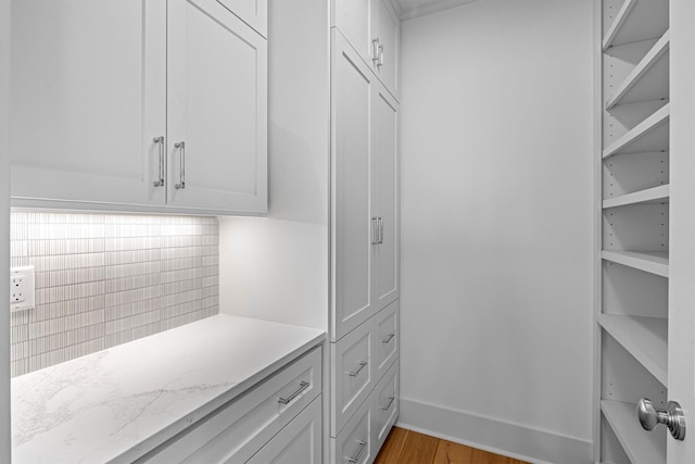 2604 E Seaside Dr, Galveston, TX 77550 - walk in closet with light wood-style flooring