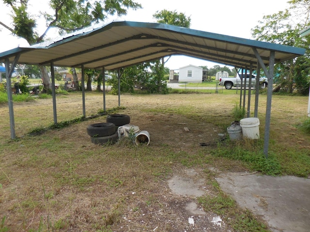 628 Austin St W, Matagorda, TX 77457 - view of grassy yard with a carport