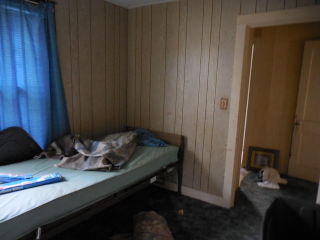 628 Austin St W, Matagorda, TX 77457 - bedroom with wood walls and carpet flooring