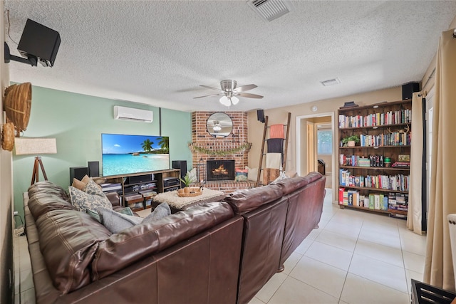 23910 Spring Day Ln, Spring, TX 77373 - living area with a wall mounted AC, a ceiling fan, a brick fireplace, light tile patterned flooring, and a textured ceiling