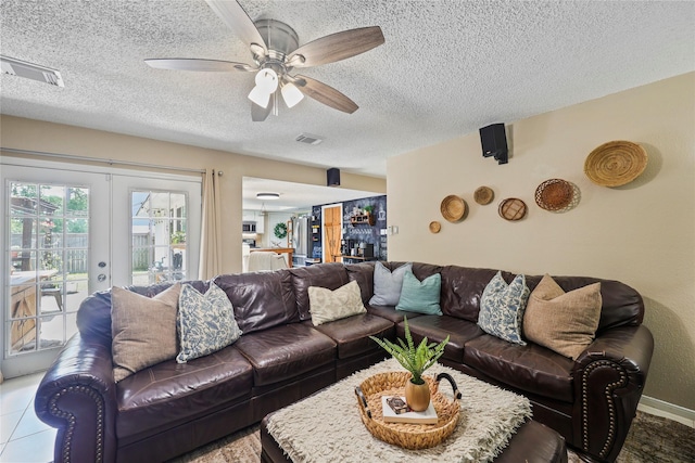 23910 Spring Day Ln, Spring, TX 77373 - living room featuring a textured ceiling, ceiling fan, and french doors