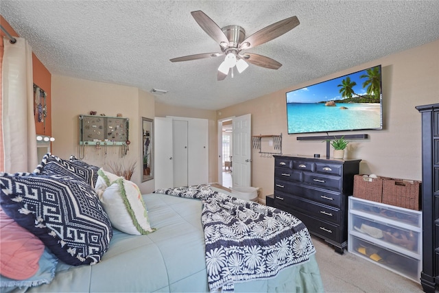 23910 Spring Day Ln, Spring, TX 77373 - carpeted bedroom featuring a textured ceiling and a ceiling fan