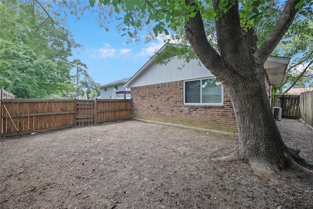 23910 Spring Day Ln, Spring, TX 77373 - fenced backyard featuring central air condition unit and a gate