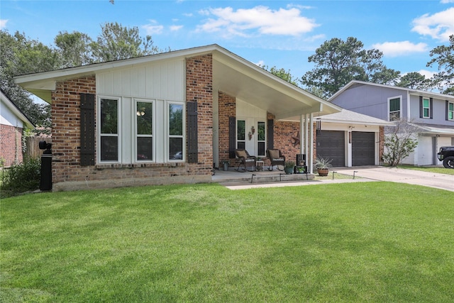 23910 Spring Day Ln, Spring, TX 77373 - mid-century home with a front yard, concrete driveway, a garage, and brick siding