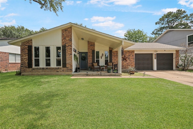 23910 Spring Day Ln, Spring, TX 77373 - view of front of property featuring an attached garage, a front yard, driveway, and brick siding