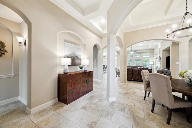1136 Hancock Springs Ln, Friendswood, TX 77546 - dining area featuring crown molding, a chandelier, a ceiling fan, and light stone finish flooring