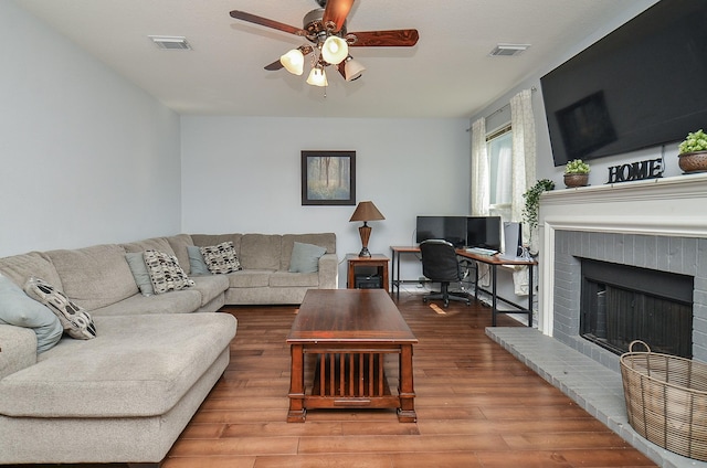 4922 Beechknoll Ln, Katy, TX 77449 - living area with a ceiling fan, wood finished floors, a fireplace, and an office area