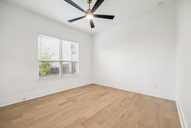 19 Sanctuary Trl, Missouri City, TX 77459 - spare room with light wood-style flooring, a smoke detector, and a ceiling fan