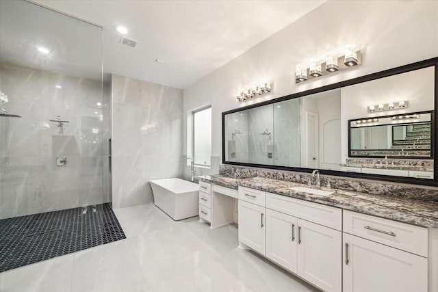 19 Sanctuary Trl, Missouri City, TX 77459 - full bath featuring a freestanding bath, a walk in shower, vanity, and marble finish floors