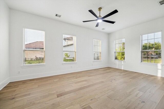 19 Sanctuary Trl, Missouri City, TX 77459 - empty room featuring light wood-style flooring and a ceiling fan