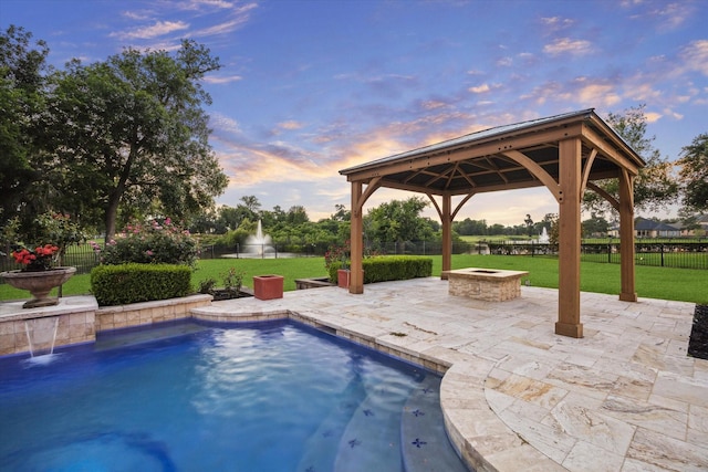 19 Sanctuary Trl, Missouri City, TX 77459 - view of swimming pool featuring a fire pit, a gazebo, a patio area, and a fenced backyard