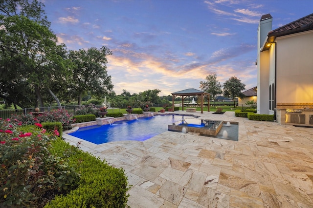 19 Sanctuary Trl, Missouri City, TX 77459 - pool at dusk with a gazebo and a patio