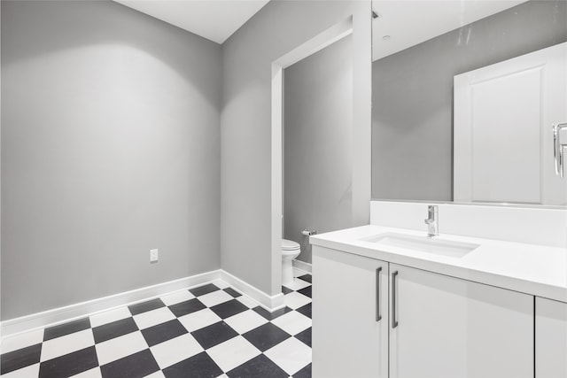 4521 San Felipe St Unit 2601, Houston, TX 77027 - bathroom featuring tile patterned floors, vanity, toilet, and baseboards