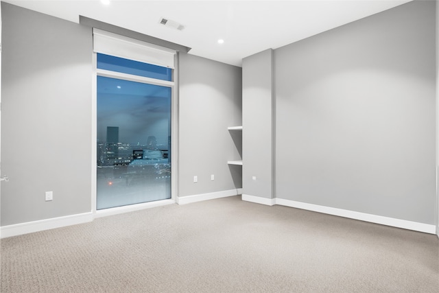 4521 San Felipe St Unit 2601, Houston, TX 77027 - empty room featuring carpet flooring, baseboards, and recessed lighting
