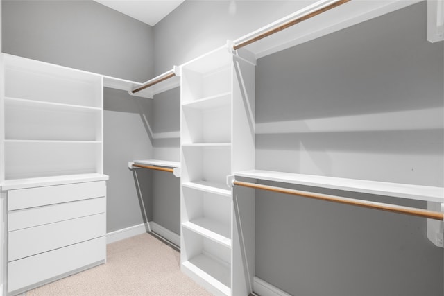 4521 San Felipe St Unit 2601, Houston, TX 77027 - walk in closet featuring light colored carpet