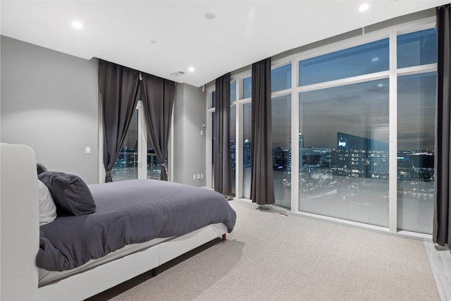 4521 San Felipe St Unit 2601, Houston, TX 77027 - carpeted bedroom with expansive windows and recessed lighting