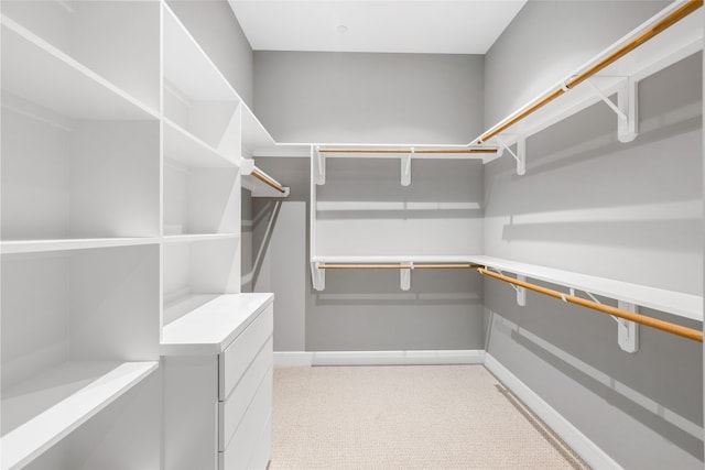 4521 San Felipe St Unit 2601, Houston, TX 77027 - walk in closet featuring light colored carpet