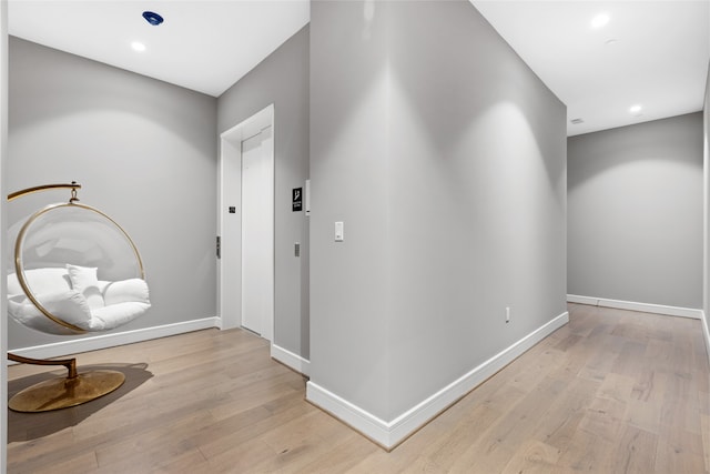4521 San Felipe St Unit 2601, Houston, TX 77027 - corridor featuring light wood-style floors, baseboards, elevator, and recessed lighting