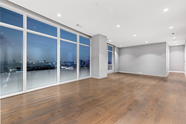 4521 San Felipe St Unit 2601, Houston, TX 77027 - unfurnished room with wood finished floors, recessed lighting, and baseboards