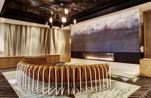 4521 San Felipe St Unit 2601, Houston, TX 77027 - misc room featuring a glass covered fireplace and a chandelier