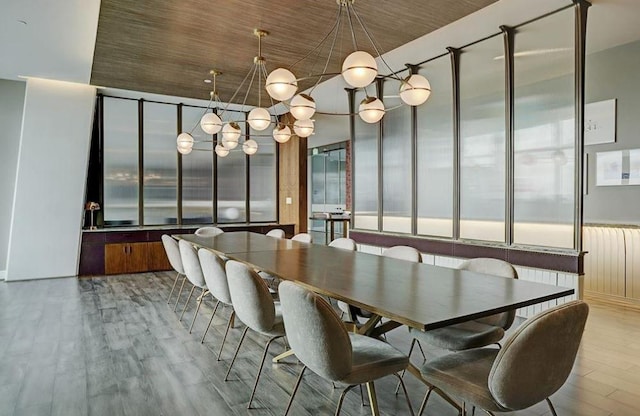 4521 San Felipe St Unit 2601, Houston, TX 77027 - dining room with a chandelier and wood finished floors