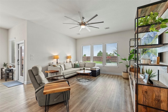 29510 Enchanted Breeze Ln, Katy, TX 77494 - living room featuring ceiling fan, wood finished floors, and baseboards